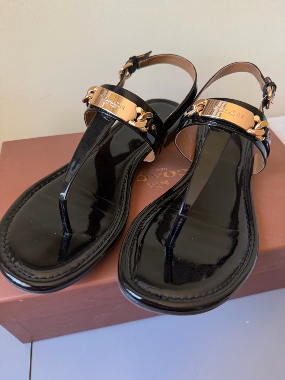 Coach Black Patent Leather T-Strap Sandals with Gold Plaque